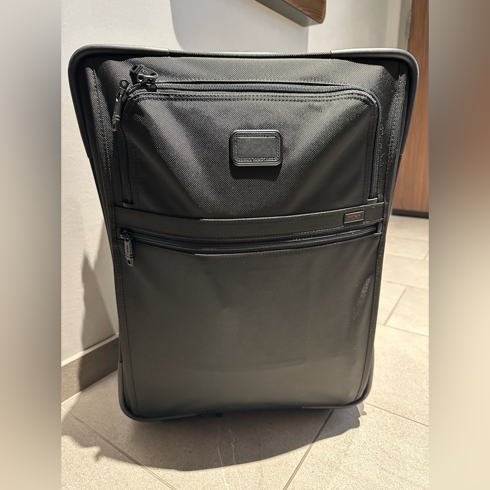 Tumi carry on suit case.